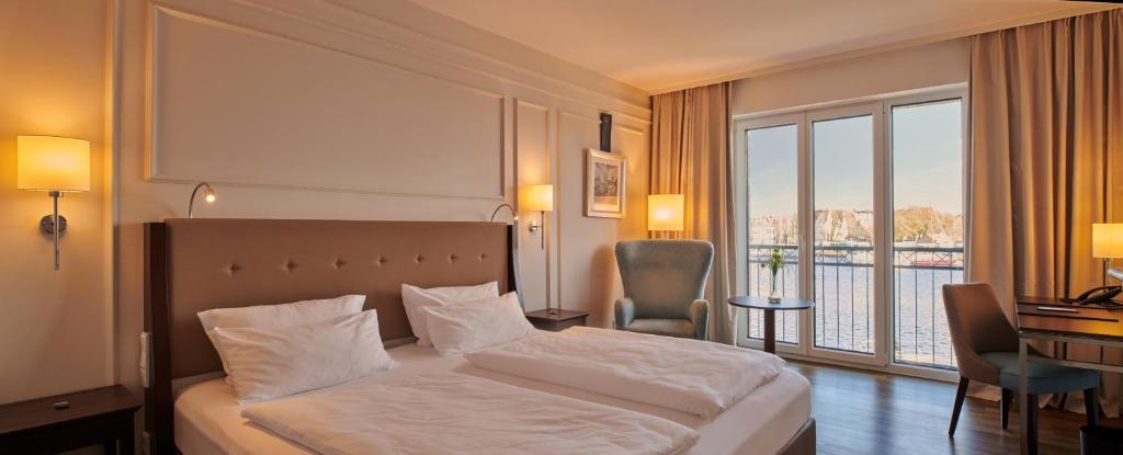 Postel nebo postele na pokoji v ubytování Hotel am Delft