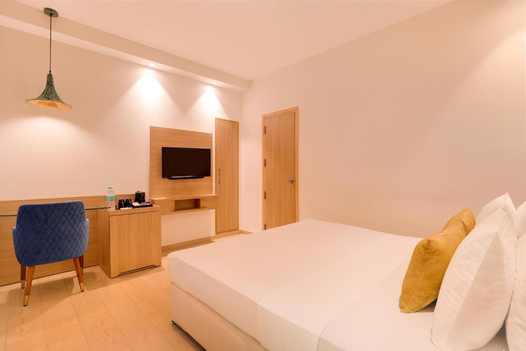 Postel nebo postele na pokoji v ubytování Keys Prima by Lemon Tree Hotels, Katti-Ma, Chennai