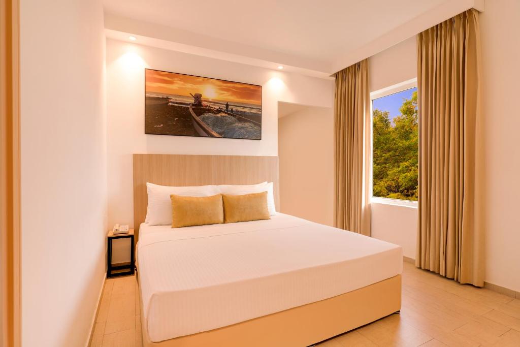Postel nebo postele na pokoji v ubytování Keys Prima by Lemon Tree Hotels, Katti-Ma, Chennai