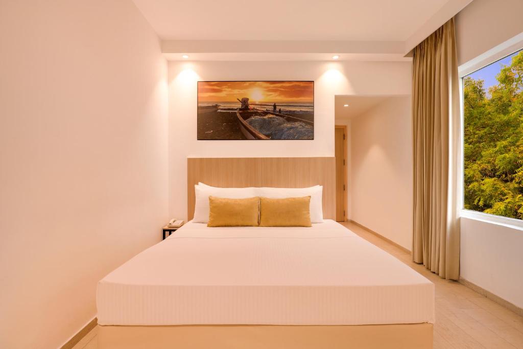 Postel nebo postele na pokoji v ubytování Keys Prima by Lemon Tree Hotels, Katti-Ma, Chennai