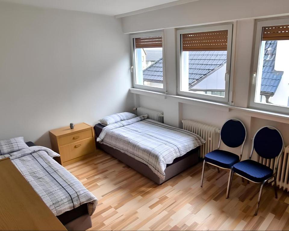 Postel nebo postele na pokoji v ubytování Monteurhaus in Hemer - Gemeinschaftsnutzung Küche und Bad