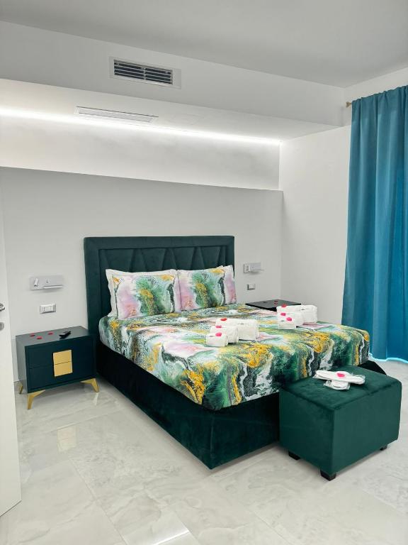 Postel nebo postele na pokoji v ubytování Nuance Suite & Rooms
