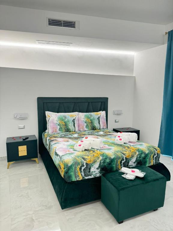 Postel nebo postele na pokoji v ubytování Nuance Suite & Rooms