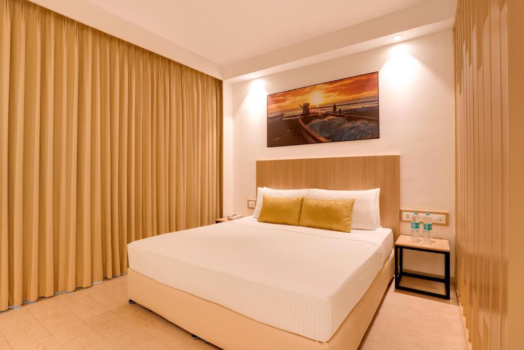 Postel nebo postele na pokoji v ubytování Keys Prima by Lemon Tree Hotels, Katti-Ma, Chennai