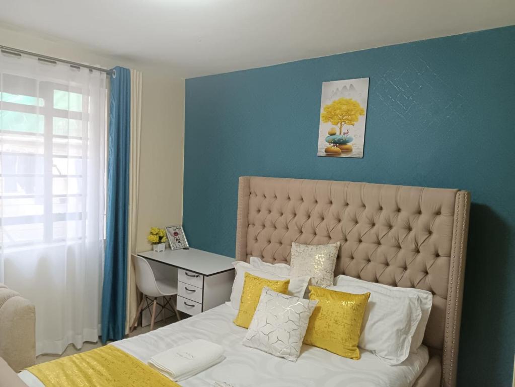 Postel nebo postele na pokoji v ubytování Cavendish Square Apartments Syokimau
