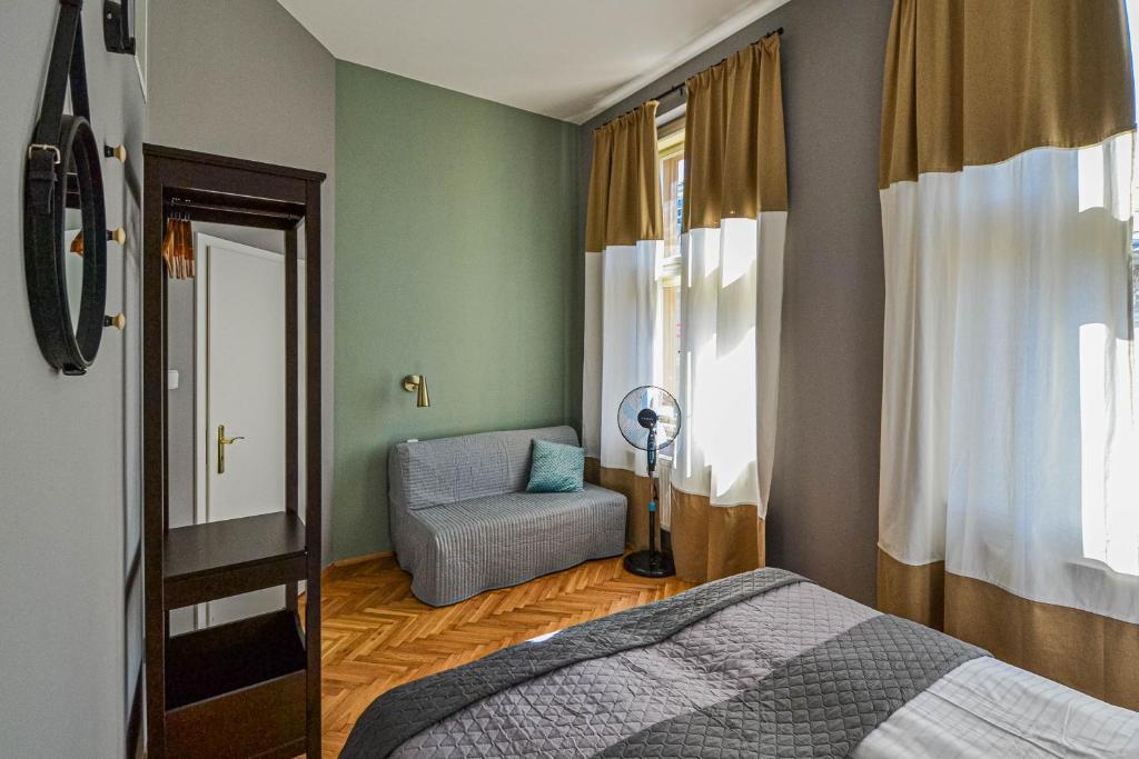 Postel nebo postele na pokoji v ubytování Celebration Flat by Ruterra