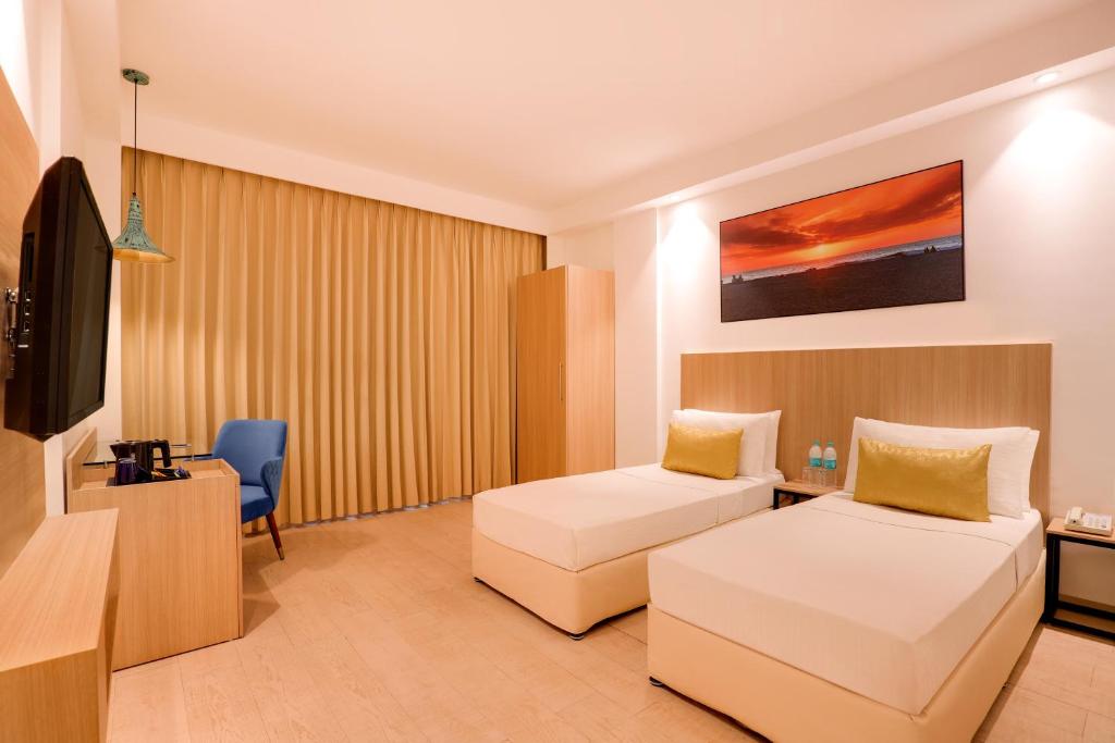 Postel nebo postele na pokoji v ubytování Keys Prima by Lemon Tree Hotels, Katti-Ma, Chennai