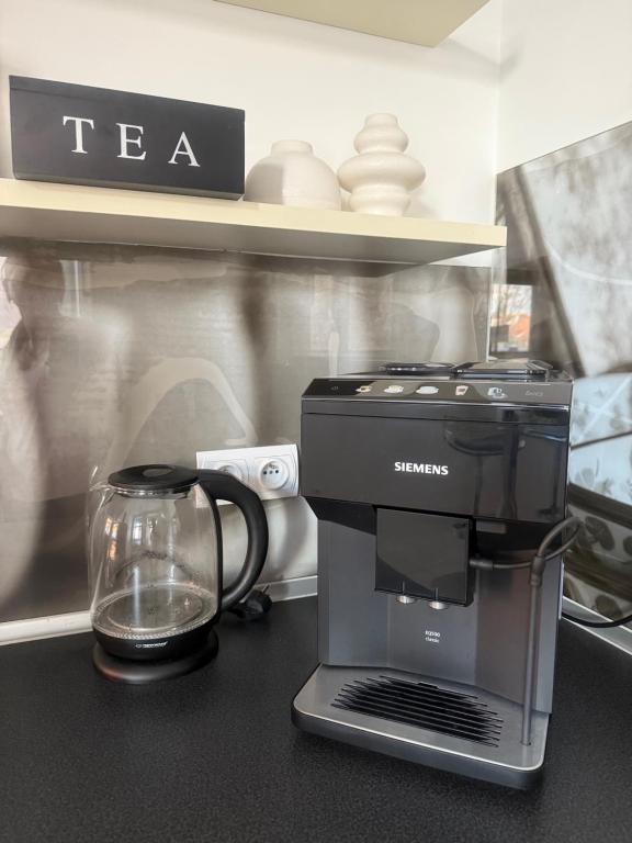 a coffee maker sitting on top of a counter at I'M Apartment SILVER I centrum free parking in Bolesławiec