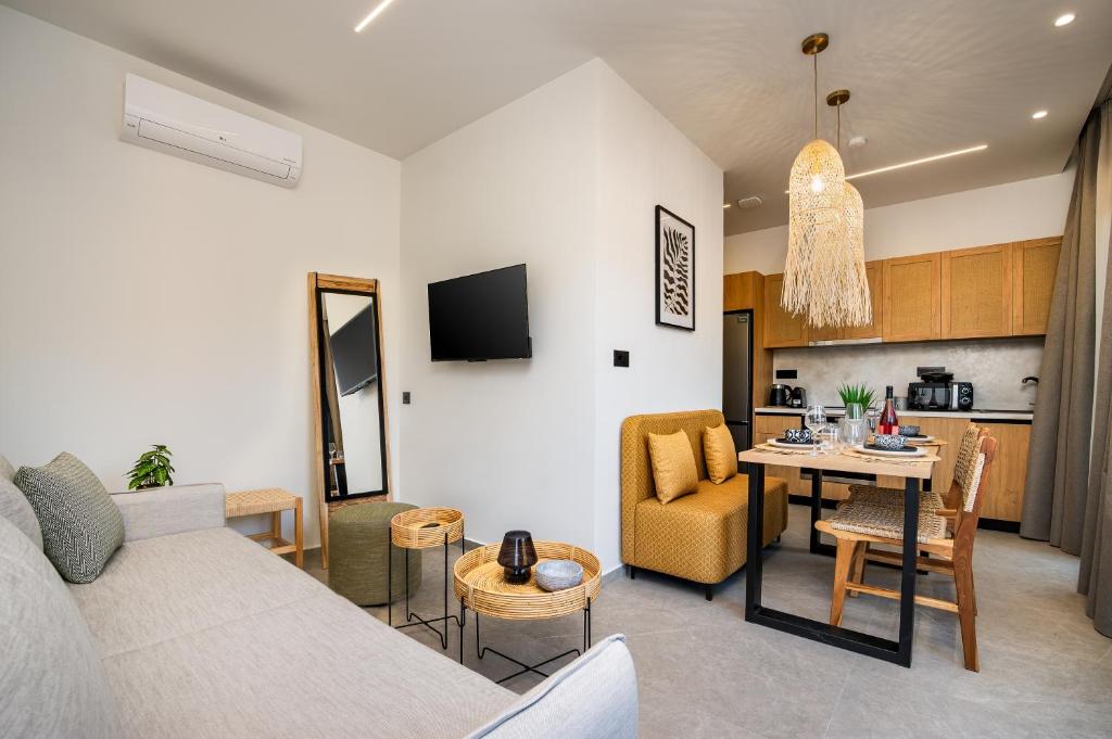 a living room with a couch and a table at Beach Luxury Homes - Zoe in Lampi