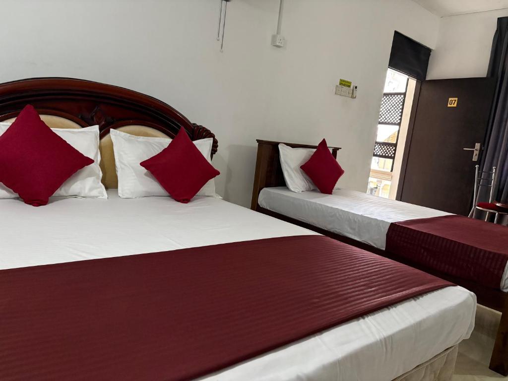 Postel nebo postele na pokoji v ubytování Dee Ella Hotel
