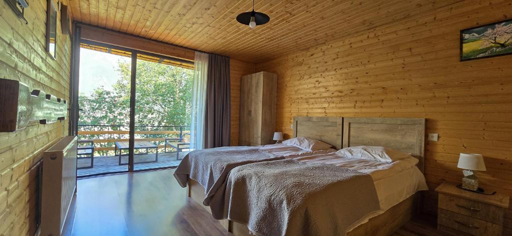 Postel nebo postele na pokoji v ubytování My Space Kazbegi