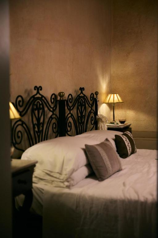 Postel nebo postele na pokoji v ubytování Palazzo Mosco - Dimora Storica