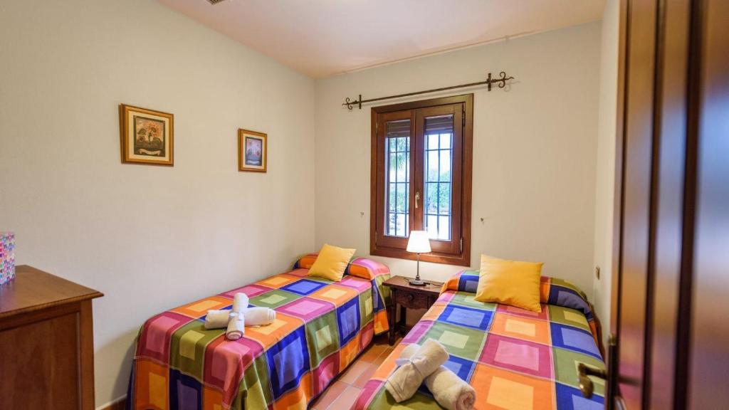 Postel nebo postele na pokoji v ubytování Finca Platero Alhaurín el Grande by Ruralidays