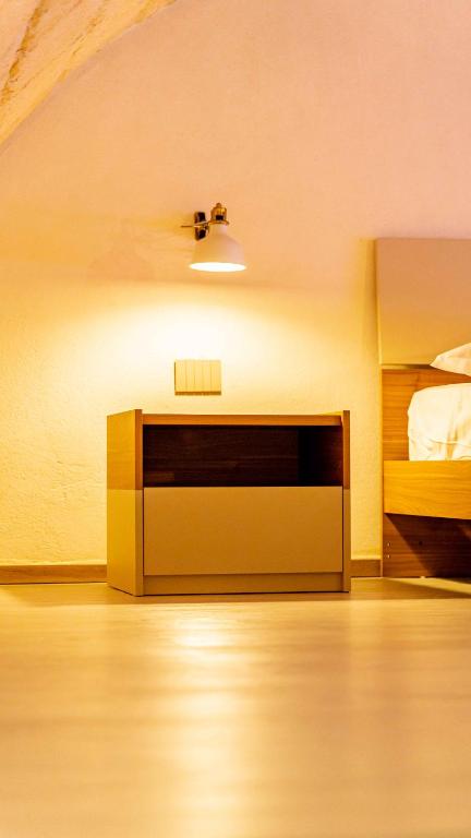 A bed or beds in a room at Il Melograno - Suite Deluxe
