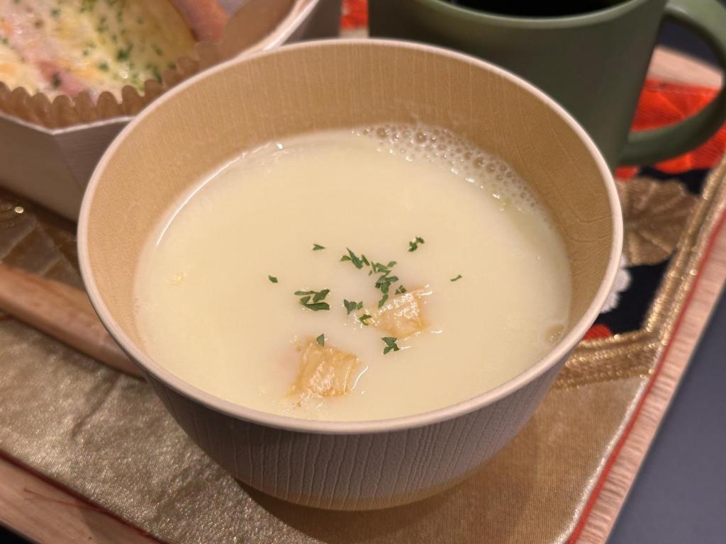 a bowl of soup with some food in it at Minn Nijo-jo in Kyoto