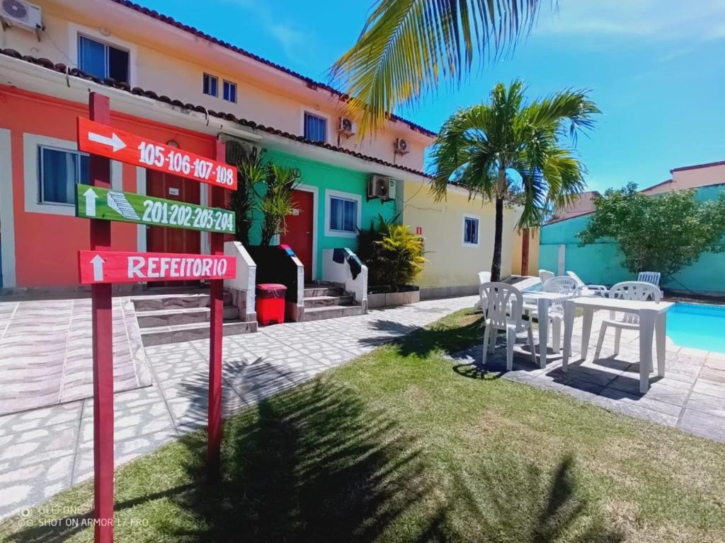 a street sign in front of a hotel at Pousada Maceio Inn in Maceió