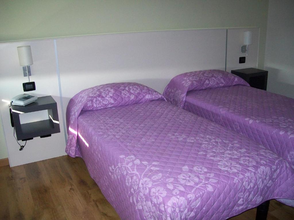 Postel nebo postele na pokoji v ubytování Hotel Motel Giglio