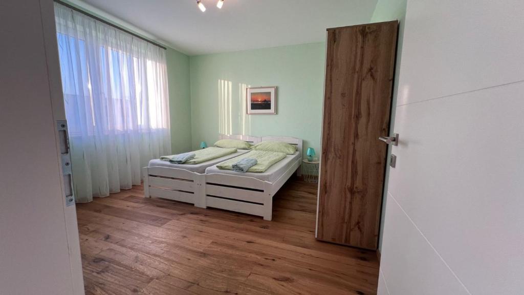 Voodi või voodid majutusasutuse Guesthouse Parndorf toas