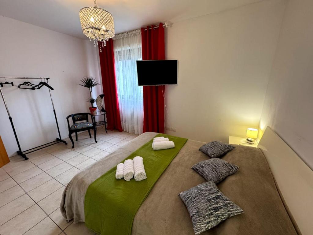 Postel nebo postele na pokoji v ubytování Casa SAFFI