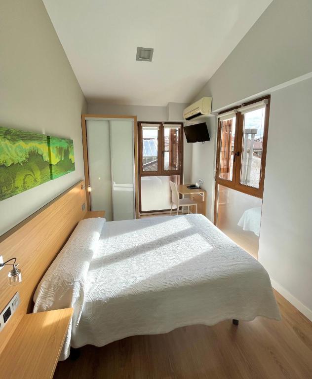 Postel nebo postele na pokoji v ubytování Hotel Olatu