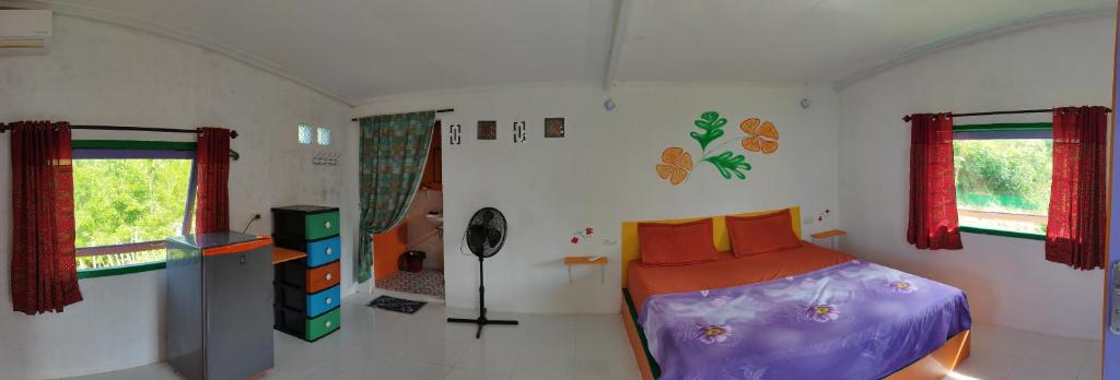 Postel nebo postele na pokoji v ubytování pulau weh sabang Coco jungle
