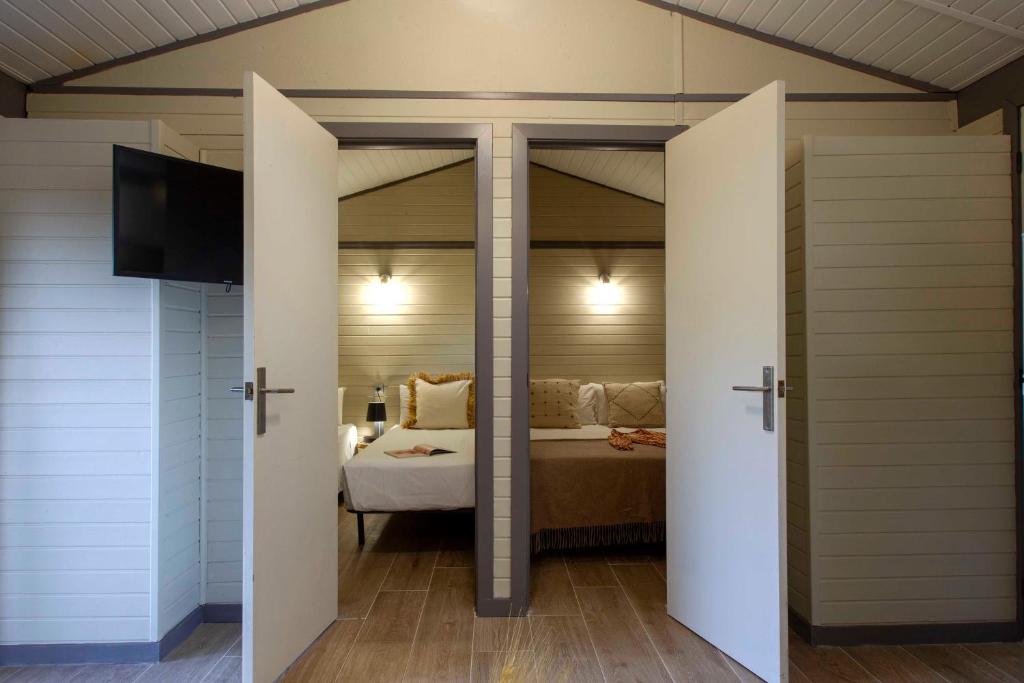 Postel nebo postele na pokoji v ubytování Camping Caledonia