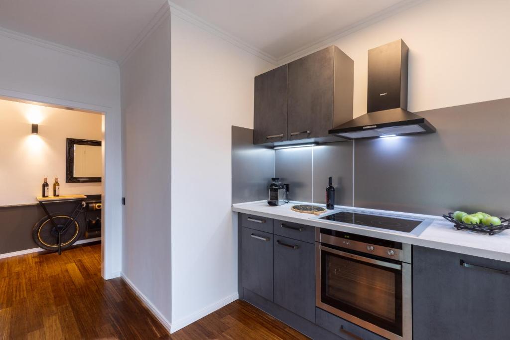a kitchen with a sink and a counter top at Mokka Suite Design in Neumünster in Neumünster