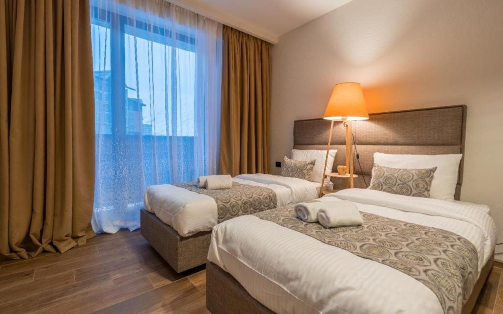 Postel nebo postele na pokoji v ubytování New Gudauri Apartments in Twins