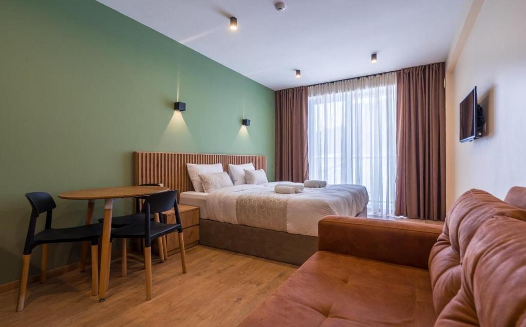 Postel nebo postele na pokoji v ubytování New Gudauri Apartments in Twins