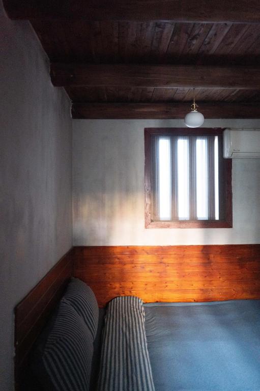 Postel nebo postele na pokoji v ubytování 島中大厝