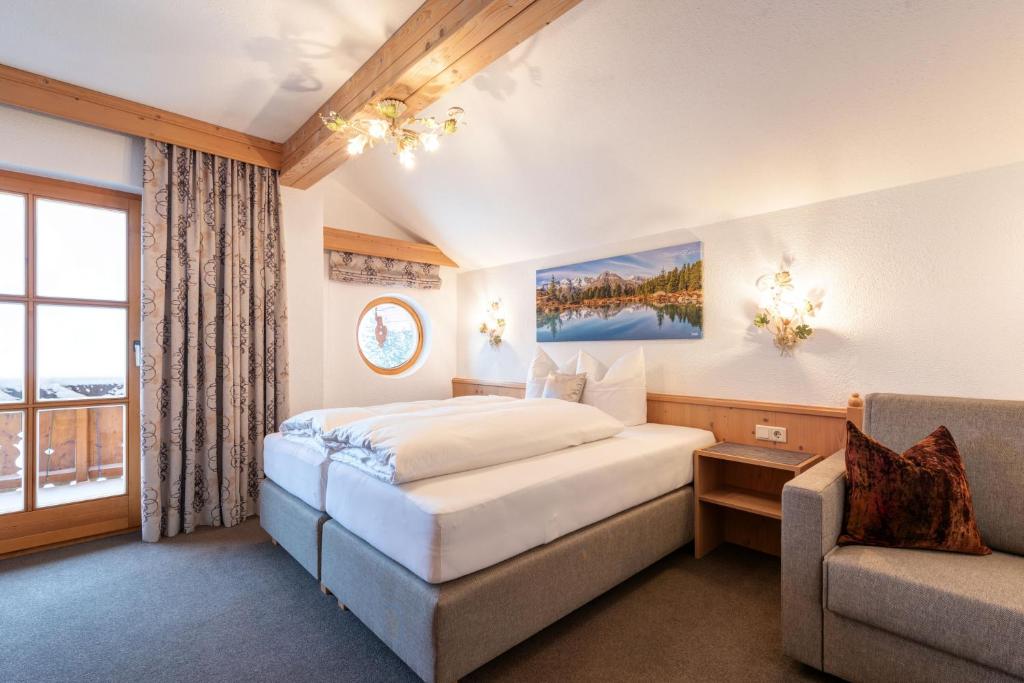 Postel nebo postele na pokoji v ubytování Landhaus Winkl
