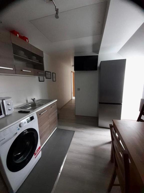 a kitchen with a washing machine in the middle at Monteurwohnungen in Gera in Gera