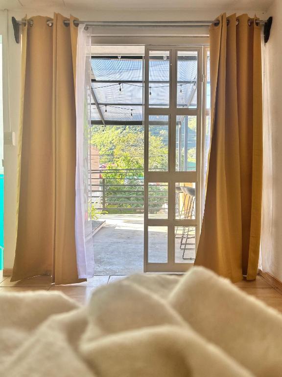 Postel nebo postele na pokoji v ubytování La Terraza Orgánica