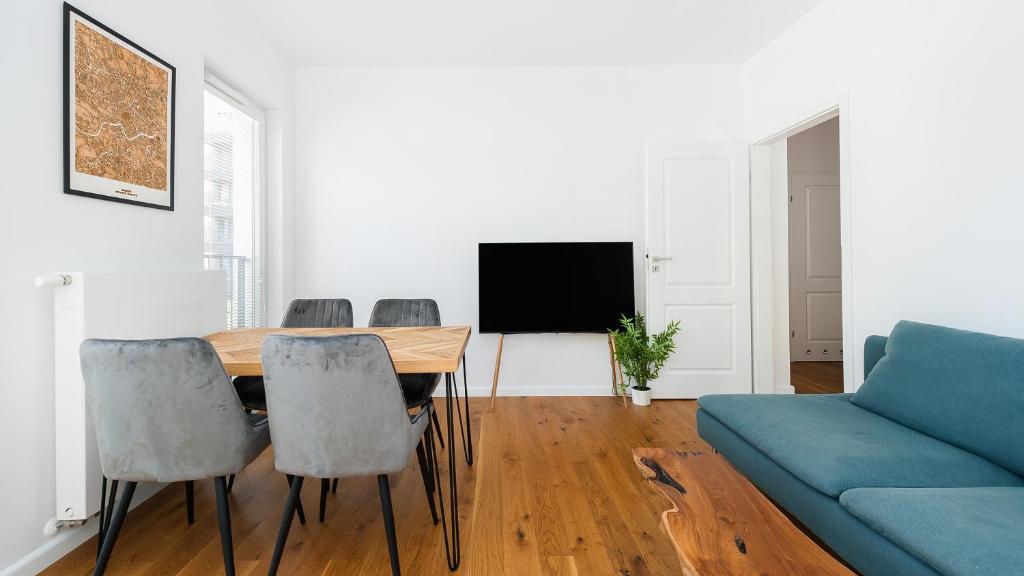 Televízia a/alebo spoločenská miestnosť v ubytovaní Apartamenty Sun & Snow Rakowicka Steam Park
