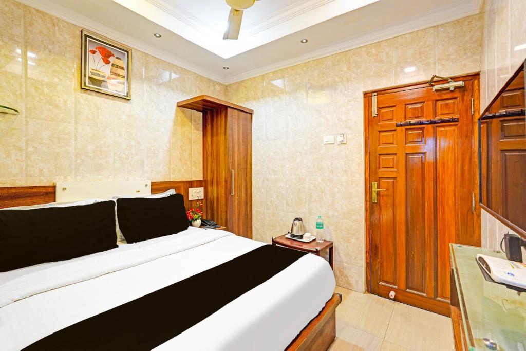 Postel nebo postele na pokoji v ubytování Super Hotel O Triplicane formerly Park Royal