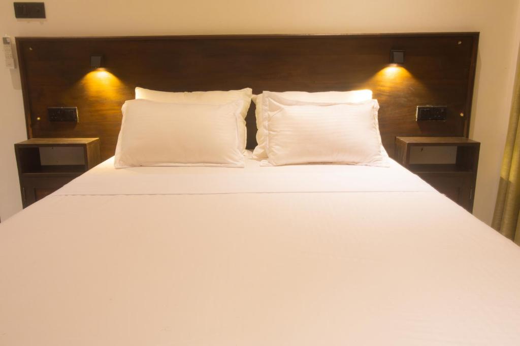 Postel nebo postele na pokoji v ubytování Luminozo Beach Hotel