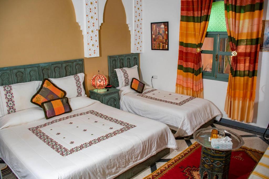 Postel nebo postele na pokoji v ubytování Le Petit Riad Maison d'hôtes