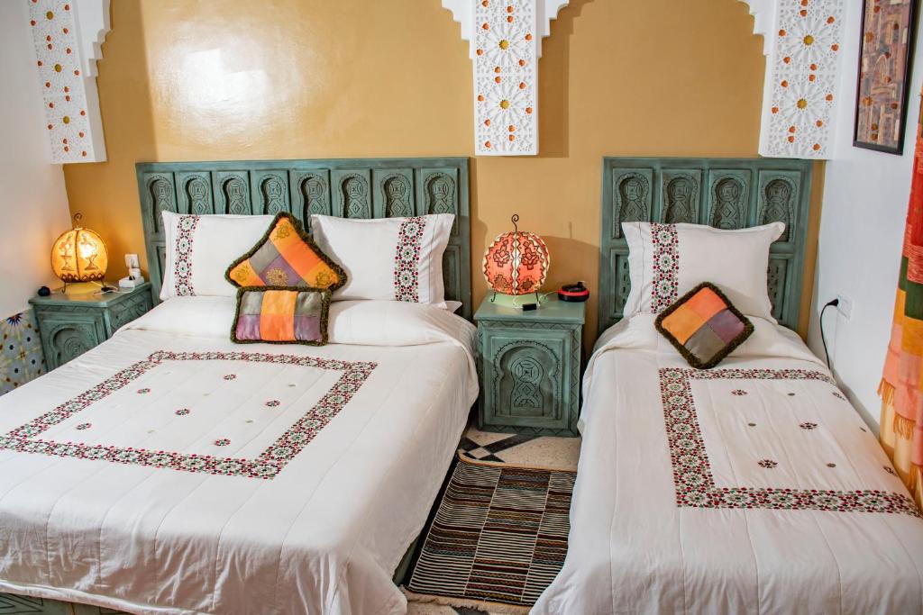 Postel nebo postele na pokoji v ubytování Le Petit Riad Maison d'hôtes