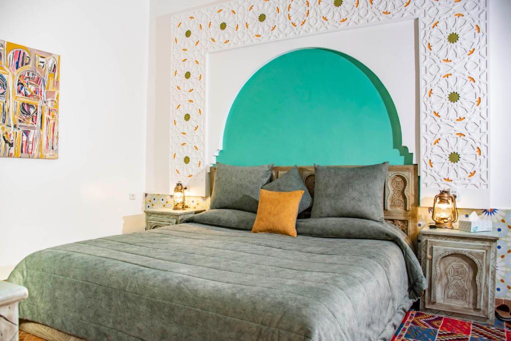 Postel nebo postele na pokoji v ubytování Le Petit Riad Maison d'hôtes