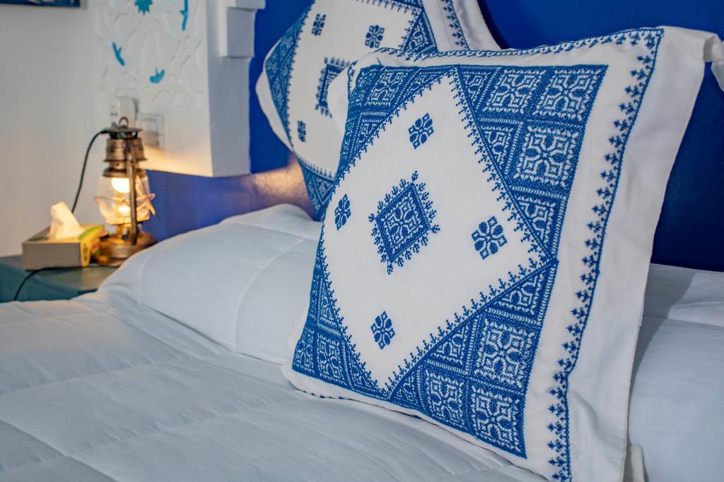 Postel nebo postele na pokoji v ubytování Le Petit Riad Maison d'hôtes