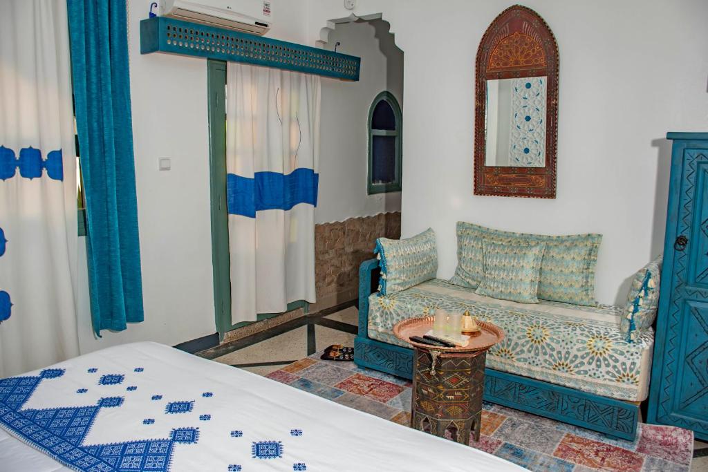 Postel nebo postele na pokoji v ubytování Le Petit Riad Maison d'hôtes