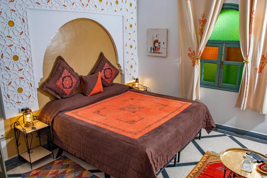 Postel nebo postele na pokoji v ubytování Le Petit Riad Maison d'hôtes