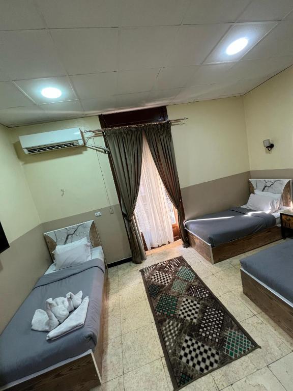 Postel nebo postele na pokoji v ubytování One Season Hotel