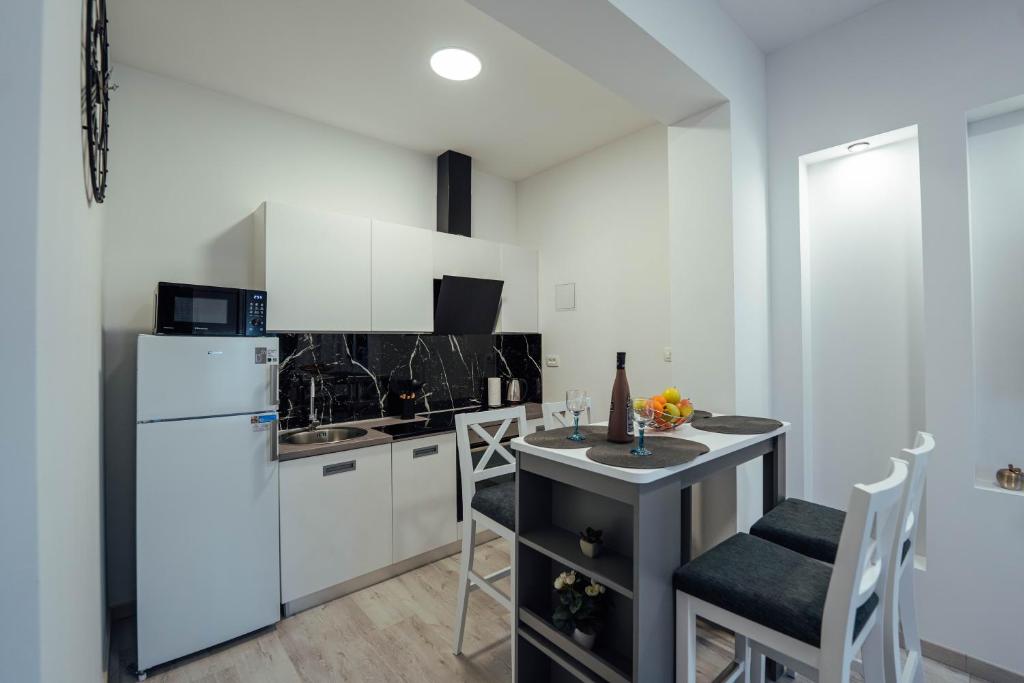 Kuchyň nebo kuchyňský kout v ubytování Apartman Anđela