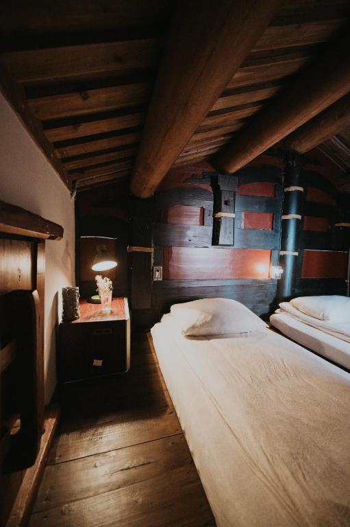 Postel nebo postele na pokoji v ubytování 島中大厝