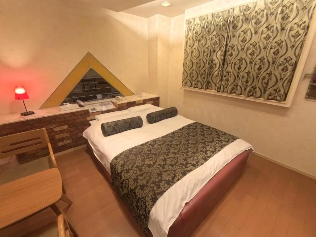 Postel nebo postele na pokoji v ubytování Hotel Sha A Nai Yan (Adult Only)