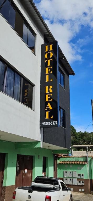 a white car parked in front of a building at Hotel Real in Ouro Preto