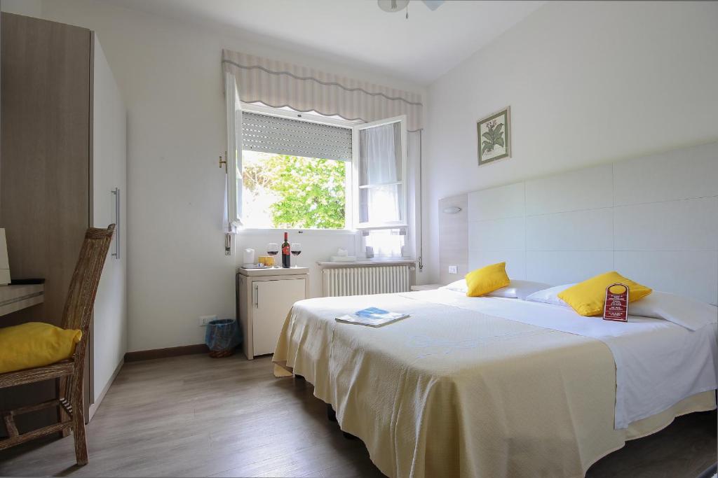 Postel nebo postele na pokoji v ubytování B&B Ortensia