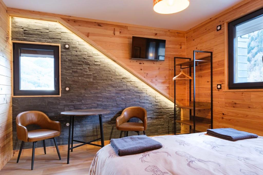 Letto o letti in una camera di Apart Hôtel des Cols