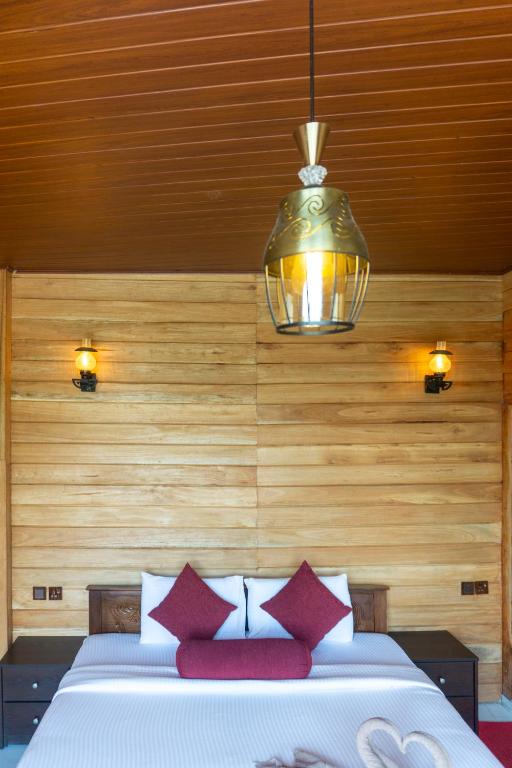 Postel nebo postele na pokoji v ubytování Refresh Inn Ella